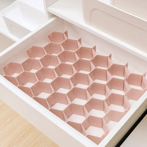 Hella Smooth Honeycomb Drawer Organizer For Closet with pink ABS plastic grid designed for sorting socks and ties.