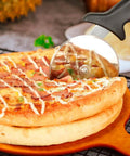 Stainless Steel Pizza Cutter Wheel 9.33 Inch Heavy Duty Rolling Slicer With Finger Guard slicing pizza on wooden board
