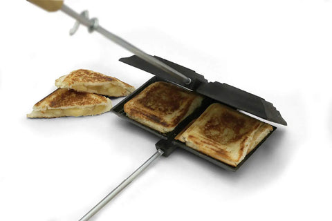 Cast Iron Double Camp Cooker Set With Two Cooking Surfaces Preseasoned For Instant Use Perfect For Camping Grillin Sandwiches And Pies Durable Outdoor Cookware Pack Of 2 showing grilled cheese sandwiches inside