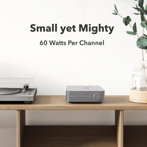 Smart Multiroom Streaming Amplifier With AirPlay Google Cast And Alexa Voice Control HDMI Output Streams Spotify Amazon Music Tidal And More Powers Passive Speakers Up To 60W Per Channel At 8 Ohms Space Gray displayed on shelf with turntable