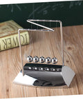 Z Shape Newtons Cradle Desk Toy for Home Office Decor, five polished silver balls on wooden surface