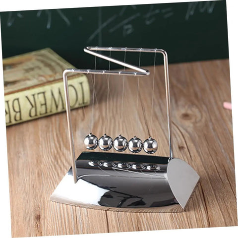 Z Shape Newtons Cradle Desk Toy for Home Office Decor, five polished silver balls on wooden surface