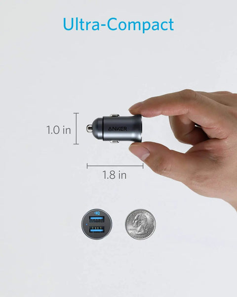 Ultra Compact Aluminum Alloy Dual USB Car Charger With Blue LED 24W Total Power held between fingers, showing size comparison with coin.