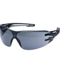Badass Wraparound Safety Glasses Delivering Panoramic Coverage And Hella Comfortable Flexible Temples For Tough Warehouse Workshop And Daily Jobsite Tasks, smoke lens, sleek design.