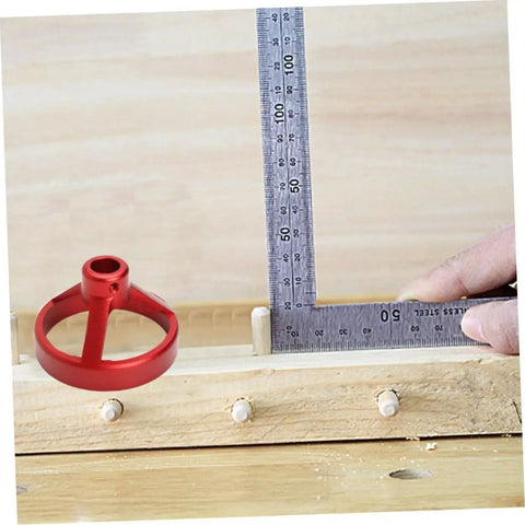 Pro Level 7 Piece Metal Hole Puncher And Drill Guide For Woodworking Rock Solid Alignment Tool Dead Nuts Accurate Positioning Kit 6 To 10 Millimeters Angled Fixture red drill guide on a wooden surface