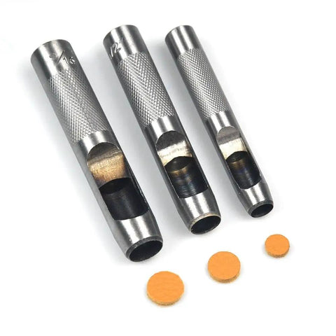 Close-up of 12 Piece Leather Hole Punch Set with Free Cutting Mat showing three metal punches with cut leather circles