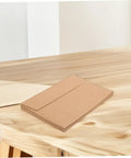 60 Pack Kraft Paper Self-Seal Envelopes, Letter Size 10.8 X 15.9 Cm, on wooden table, rustic look for wedding invitations.