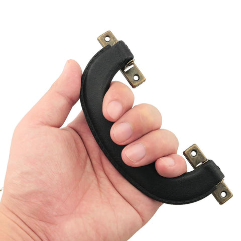 Hand holding 4 Pieces Vintage Style Luggage Handle Fittings In Black Leather And Plastic Replacement Hardware for Suitcases