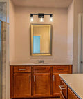 Industrial Matte Black 3 Light Bathroom Vanity Sconce Set Dope Modern Wall Lighting in bathroom with clear glass shades.