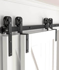Front view of Five Foot Bypass Sliding Barn Door Hardware Kit For Double Wooden Doors On A Single Track With Combination Track Mode Fits Door Openings Up To Fifty Seven Inches Easy Install Roughly Six Inch Overlap Space on white wall.