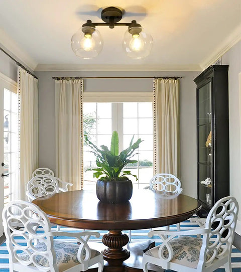 Two Light Globe Glass Ceiling Light Fixtures Semi Flush Mount for living room with round table and chairs.