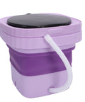 Slick Mini Folding Washing Machine 6 Liter Portable Unit designed for college dorms, purple collapsible body with drain hose.