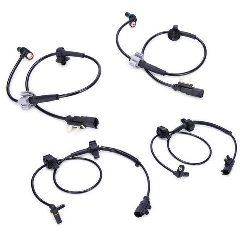Set of four black ABS wheel speed sensors with gray connector housings and wiring for front and rear wheels.