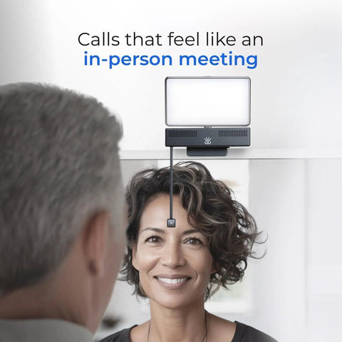 Total Game Changer 4K Eye Contact Webcam Featuring Retractable Arm And Integrated Glow Panel Flips Up Clean Out Of Sight For Seamless Video Calls And Stress Free Streaming with woman smiling during video call.