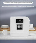 Plug And Play Portable Countertop Dishwasher Automatic Smart Wash System With Built In Storage And Disinfection Mode No Install Headaches compact device with display, plates beside it.