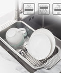 Extendable Over Sink Colander In Stainless Steel holding dishes and cutlery over sink, Adjustable Width Fits Most Sinks