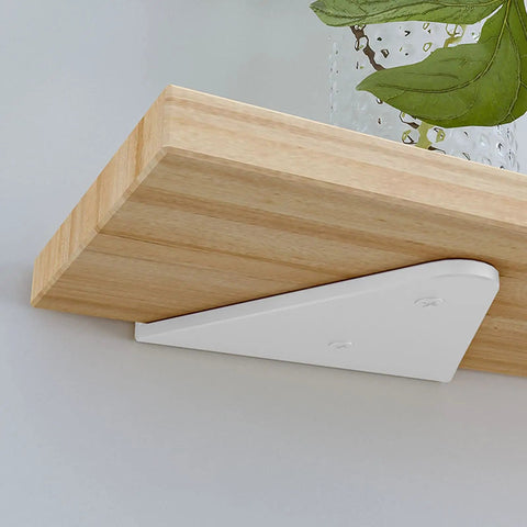 Hella Sturdy Hidden Shelf Brackets Weight Bearing Floating Support Heavy Duty Triangle Wall Mounts For Living Room Decor And Rust Resistant Display 2 Pack White holding a wooden shelf.