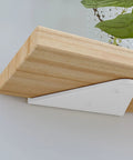 Heavy Duty Floating Shelf Brackets 2 Pack Wall Mounted Metal Supports Built Like A Tank 3mm Steel One Piece Rust Proof Triangle Mount For Diy Home Storage 7.9 Inches Long, featuring compact white bracket under wooden shelf.