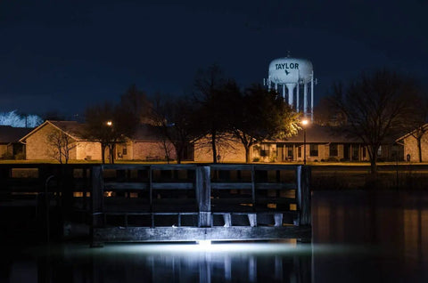 White Underwater Fishing Light 15000 Lumens With Timer And 30ft Cord illuminating water near a dock at night