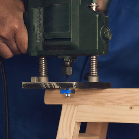 Slick Smooth Heavy Duty Rabbet Router Bit Set 4 Piece Quarter Inch Shank Carbide Tip in use with a handheld router on wood.