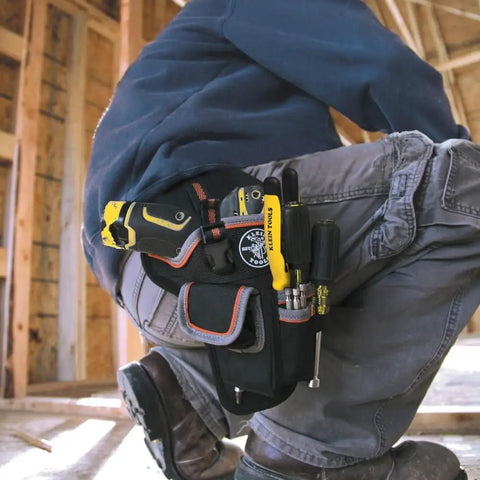 Tradesman Pro Drill Pouch With Pockets For Tools And Bits in use on work belt, holding drill and tools, heavy duty 1680D material.