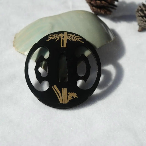 Samurai Sword Koshirae Tsuba Iron Carved 001-026 TDH 026 2.95 To 2.87 In Hand Guard with golden detailing on snow