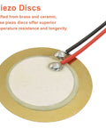Close-up of brass-ceramic piezo disc with pre-wired leads for drum triggers and guitar pickups.
