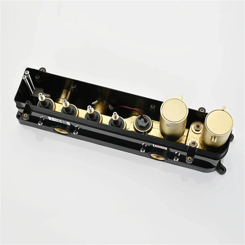 Fire Smart Shower System featuring thermostatic control in sleek matte black with brass components and intuitive dials.