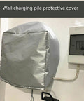 Hella Weatherproof EV Charger Station Protector Box Crafted From Heavy Duty Oxford Cloth Shields Against Rain Sun UV And Snow While Offering Smooth Outdoor Setup For Reliable Daily Use, silver wall-mounted protective cover.
