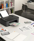 Slick Wireless All In One Home Office Printer Scanner Copier on desk with documents, mobile devices, and notebook.