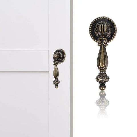 Vintage Zinc Alloy Cabinet Handle Single Hole Round Antique Pull with bronze finish on white cabinet door