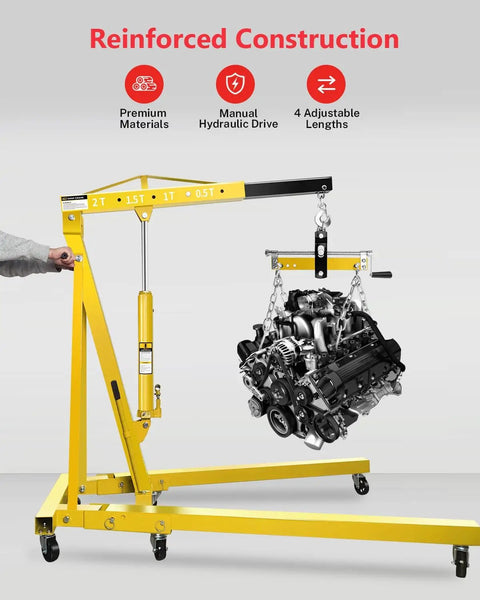 Built Tough Two Ton Hydraulic Engine Hoist Crane Featuring Rock Solid Folding Frame With Six Swivel Locking Casters And Smooth Adjustable Telescopic Boom lifting an engine with a manual hydraulic drive.