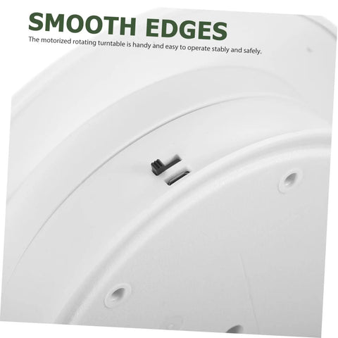 Close-up of the bottom of a Rotating Electric Turntable Display Stand With Smooth Motorized Motion, showcasing smooth edges and controls.