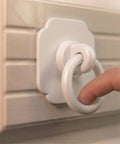 Four Pack Satin White Cabinet And Bifold Ring Pull Handles With One And Three Fifths Inch Backplate installed on louvered cabinet door