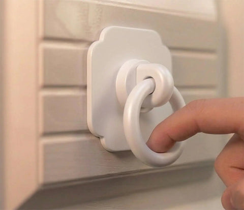 Four Pack Satin White Cabinet And Bifold Ring Pull Handles With One And Three Fifths Inch Backplate installed on louvered cabinet door