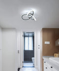 Lit Modern Ceiling Light With 6500K Cool White LED Metal Curved Design Ceiling Fixture Sleek Chrome Finish in bathroom setting