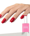 Hand with red nails using Dope Big Apple Red Gel Polish Salon Grade 0.5 Fl Oz Soak Off UV LED Cure For 60 To 90 Seconds Safe Low Odor HEMA Free TPO Free