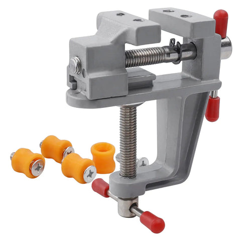 Rock Steady Mini Bench Vise Snags Loose Pieces For Jewelry Woodcarving And Watch Repair Ace Portable Table Vice with orange grips.