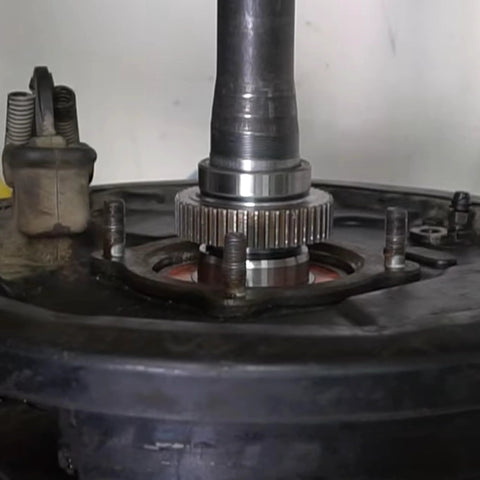 Close-up of rear axle bearing retainer installed, compatible with Toyota Land Cruiser and Tundra, model 42423 34040.