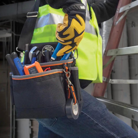 Tradesman Pro Tool Pouch With Padded Shoulder Strap And Reinforced Bottoms 15 Pocket Tool Organizer in use on jobsite