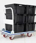 Rock Solid Heavy Duty Swivel Casters With Twin Locking Brakes And Tough 5 Inch Steel Wheels on a cart carrying black bins.