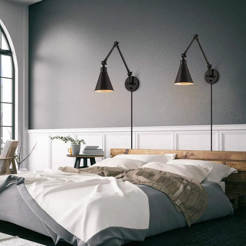 Bedroom scene with set of 2 swing arm plug in wall lamps with dimmable switch, industrial black metal reading sconces above bed.