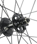 Close-up of hub on Carbon Disc Wheelset 50C-23 Clincher Road Wheel Six Bolt Rotor 12x100 Thru Axle Built For Speed Lightweight Aero Carbon Rim