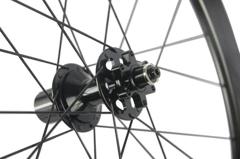 Close-up of hub on Carbon Disc Wheelset 50C-23 Clincher Road Wheel Six Bolt Rotor 12x100 Thru Axle Built For Speed Lightweight Aero Carbon Rim