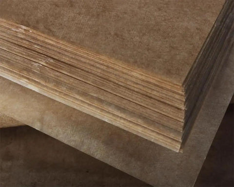 10 Pack Anti Rust Paper With VCI Technology For Metal Parts Bearings Tools And Precision Instruments, Moisture Proof Wax Coated Packaging Paper In Brown 900 By 600 Mm, Delivers Up To Five Year Rust Protection In Sealed Packaging. Brown VCI anti-rust paper sheets stacked for metal parts and tools.