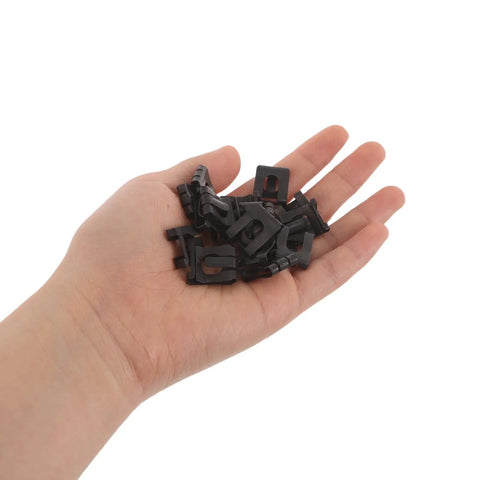 Hand holding 30-Piece Gas Lift Retaining Clips For Chair Cylinders M8 External Snap Ring, black universal clip set.