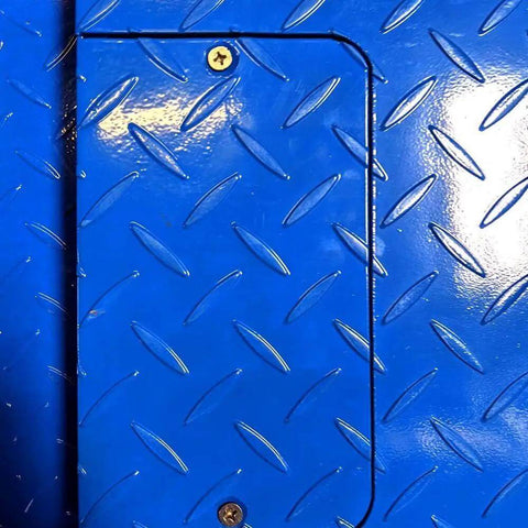 Close-up of blue diamond plate surface on Beefy Heavy Duty Industrial Floor Scale With Carbon Steel Ramp For Pallet Weighing In Warehouse.