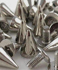 Close-up of 10pcs DIY silver cone studs and spikes rivets for leather crafts