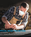Man wearing NIOSH Approved N95 Particulate Respirator Face Mask 30 Pack White With Adjustable Nose Clip Latex Free For A Secure Seal
