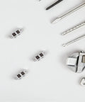 Slick Rolling Mini Caster Wheels With Tight Grip Double Row Plates And Heavy Duty Carbon Steel Brackets For Smooth Cabinet Upgrades And Lightweight DIY Gear Transport Projects Zero Wobble Guarantee Set Of Four on a work surface with tools.
